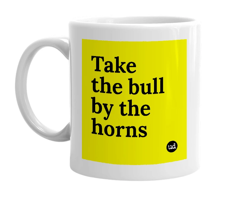 White mug with 'Take the bull by the horns' in bold black letters