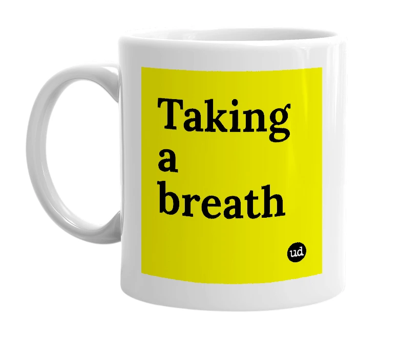 White mug with 'Taking a breath' in bold black letters