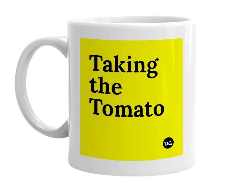 White mug with 'Taking the Tomato' in bold black letters
