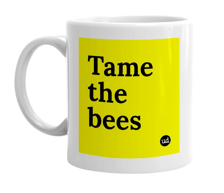 White mug with 'Tame the bees' in bold black letters