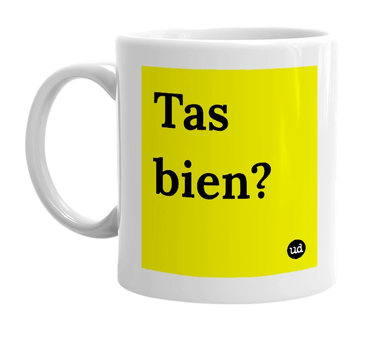 White mug with 'Tas bien?' in bold black letters