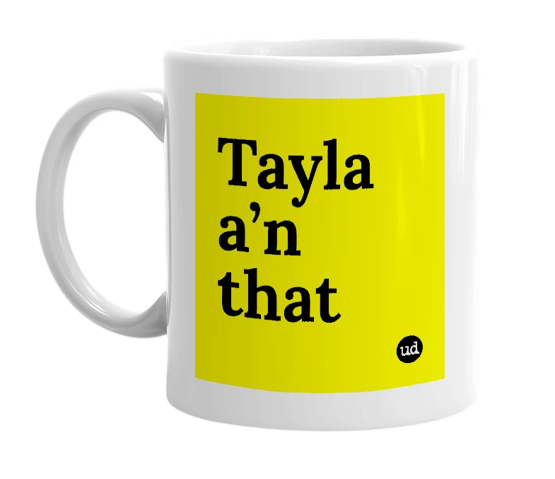 White mug with 'Tayla a’n that' in bold black letters