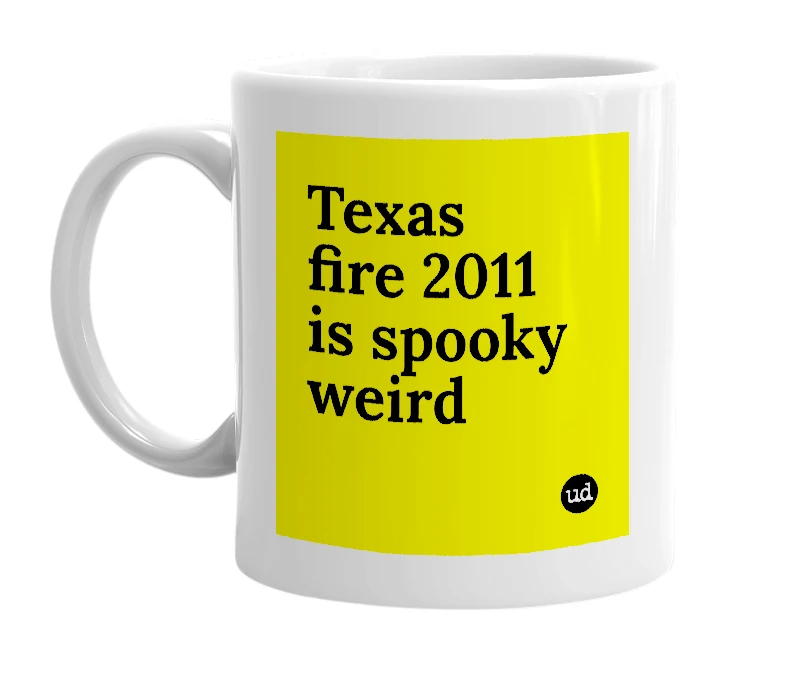 White mug with 'Texas fire 2011 is spooky weird' in bold black letters