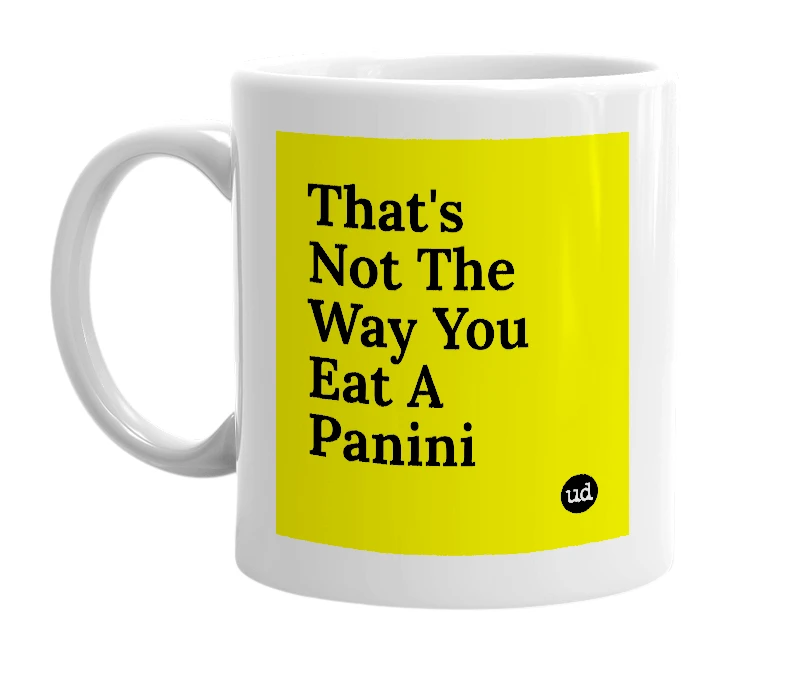 White mug with 'That's Not The Way You Eat A Panini' in bold black letters
