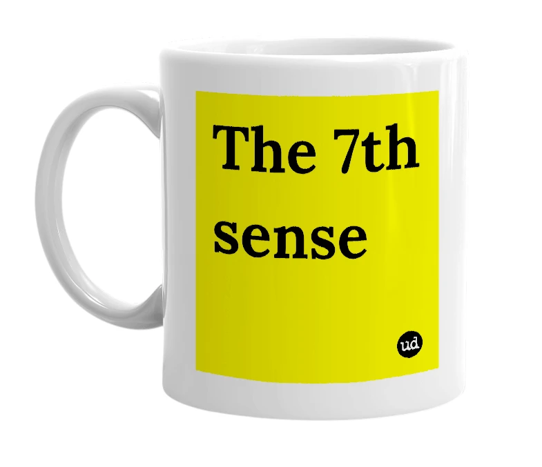 White mug with 'The 7th sense' in bold black letters
