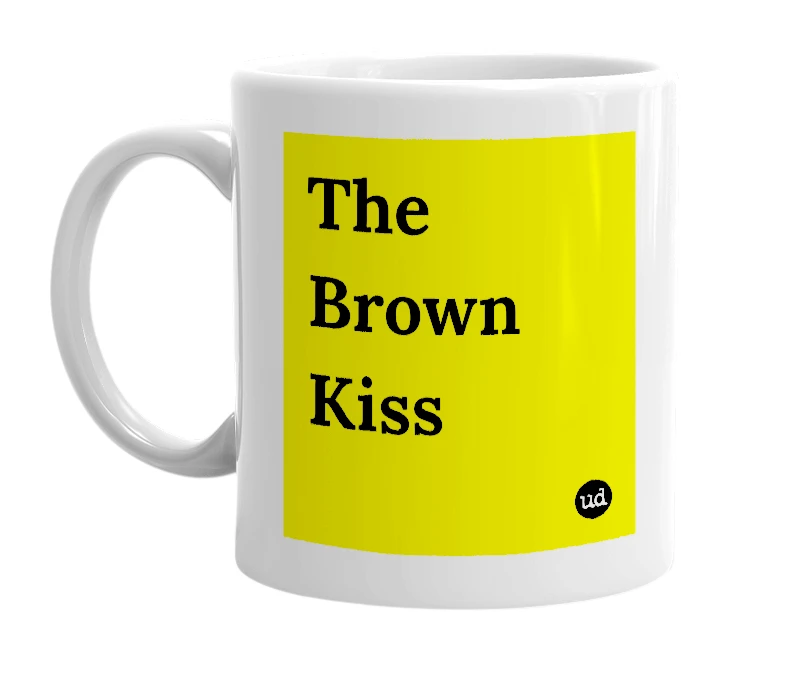 White mug with 'The Brown Kiss' in bold black letters