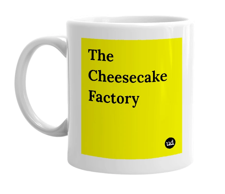 White mug with 'The Cheesecake Factory' in bold black letters
