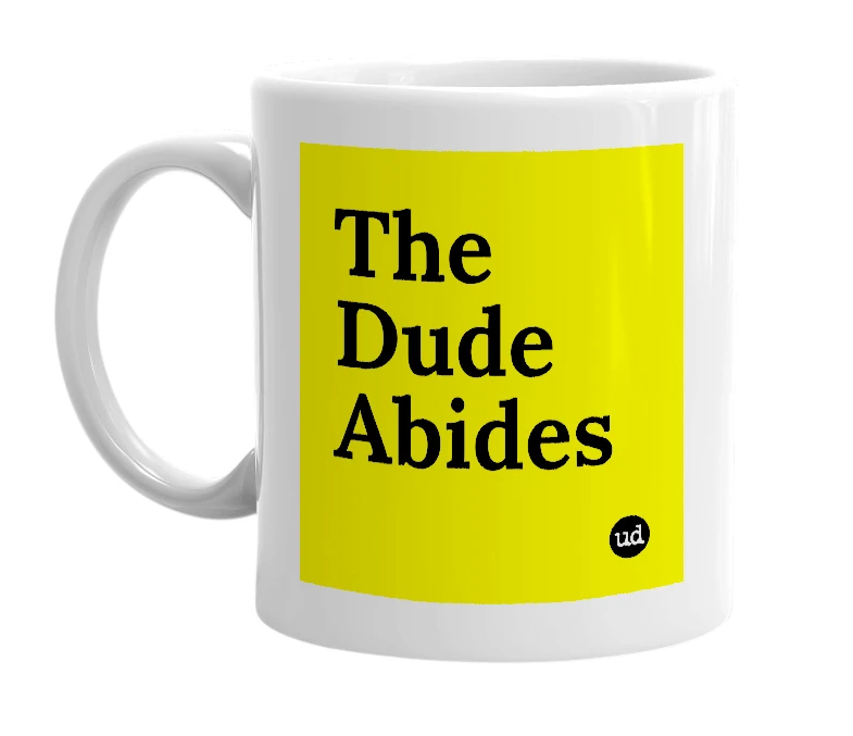 White mug with 'The Dude Abides' in bold black letters