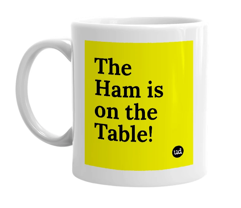 White mug with 'The Ham is on the Table!' in bold black letters