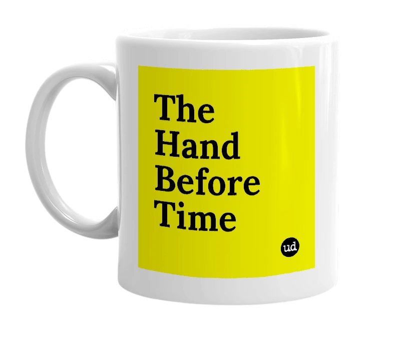 White mug with 'The Hand Before Time' in bold black letters