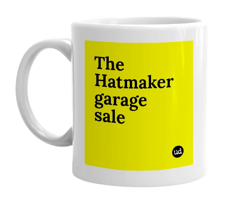 White mug with 'The Hatmaker garage sale' in bold black letters