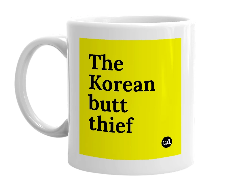 White mug with 'The Korean butt thief' in bold black letters