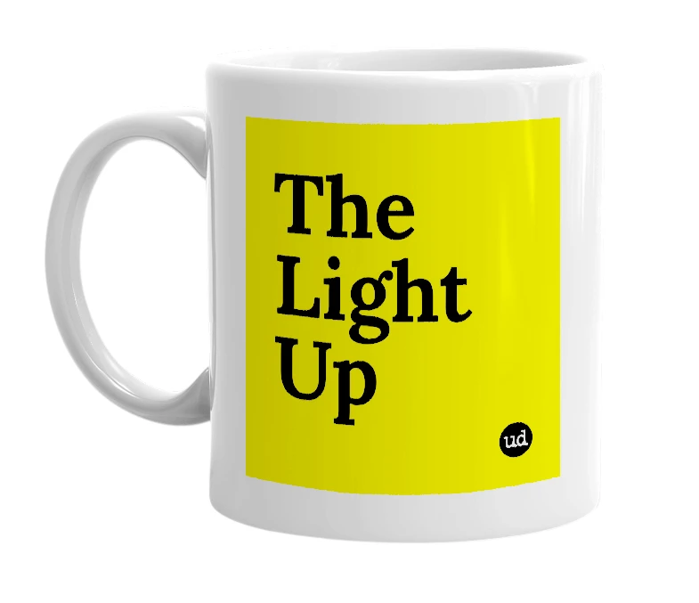 White mug with 'The Light Up' in bold black letters