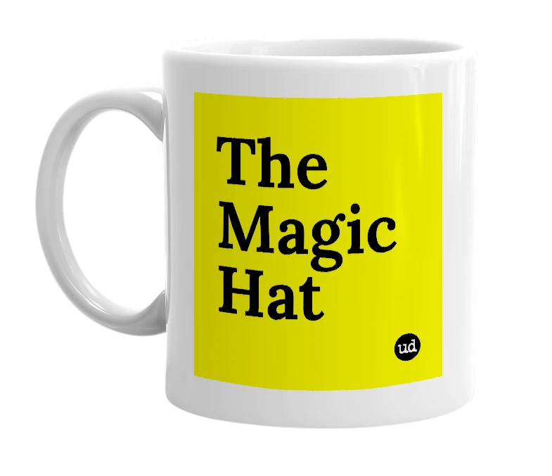 White mug with 'The Magic Hat' in bold black letters