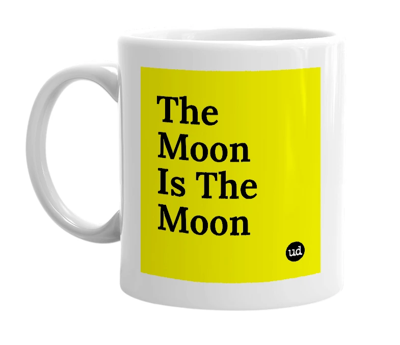 White mug with 'The Moon Is The Moon' in bold black letters