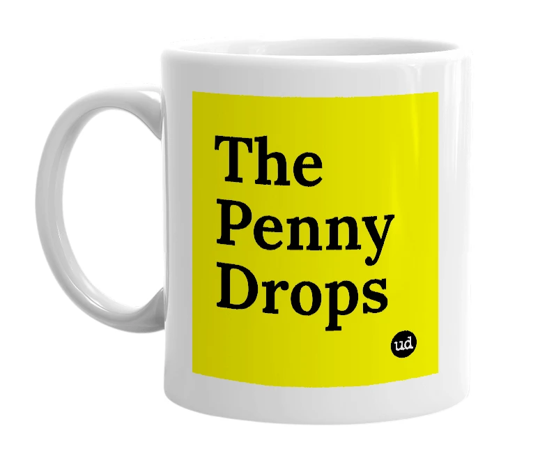 White mug with 'The Penny Drops' in bold black letters