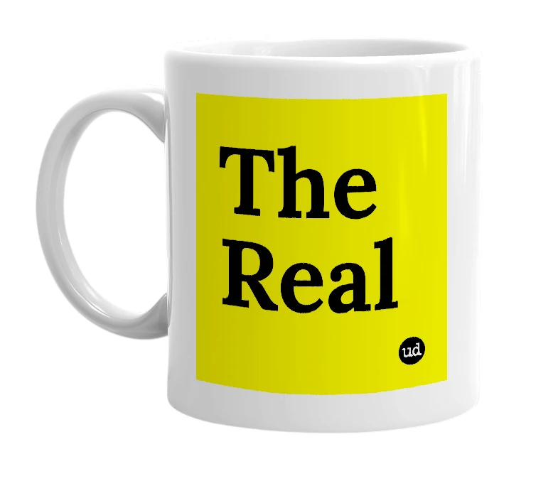 White mug with 'The Real' in bold black letters