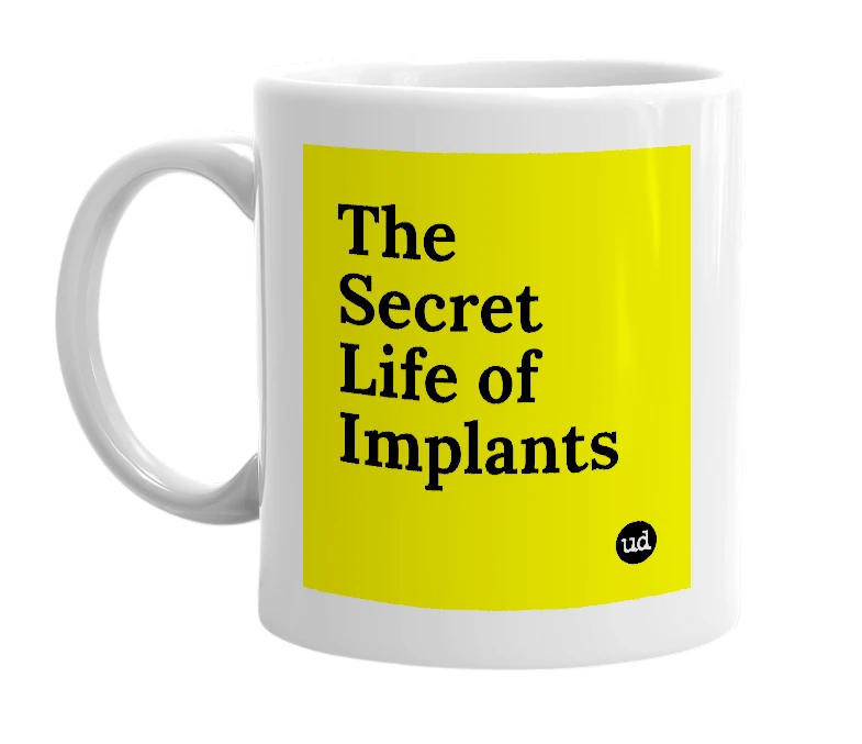 White mug with 'The Secret Life of Implants' in bold black letters