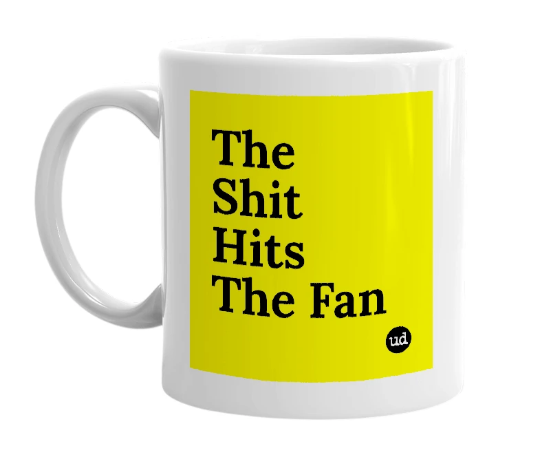 White mug with 'The Shit Hits The Fan' in bold black letters
