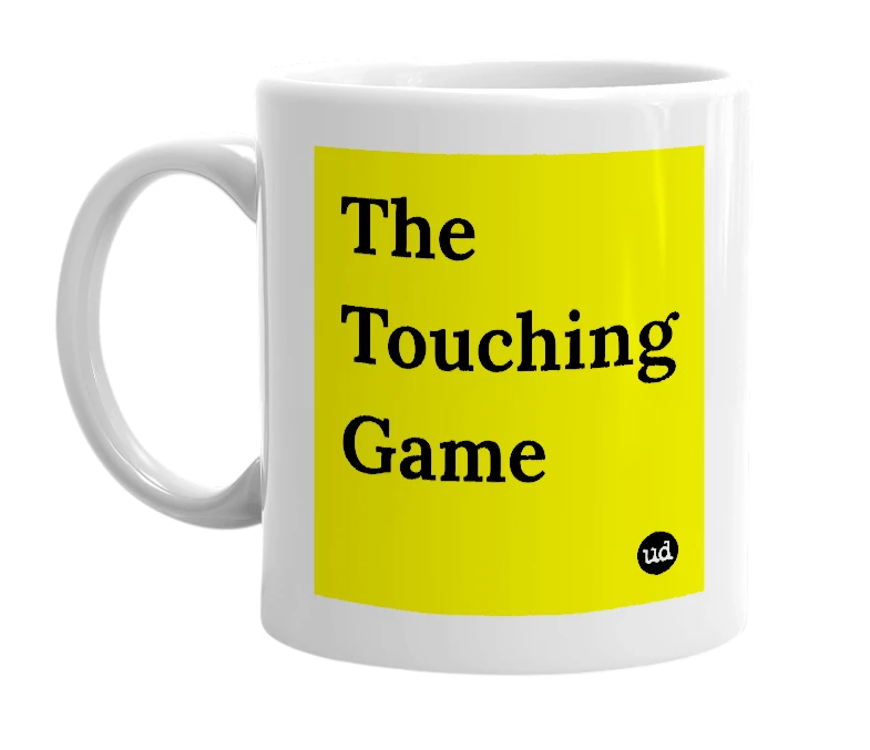 White mug with 'The Touching Game' in bold black letters