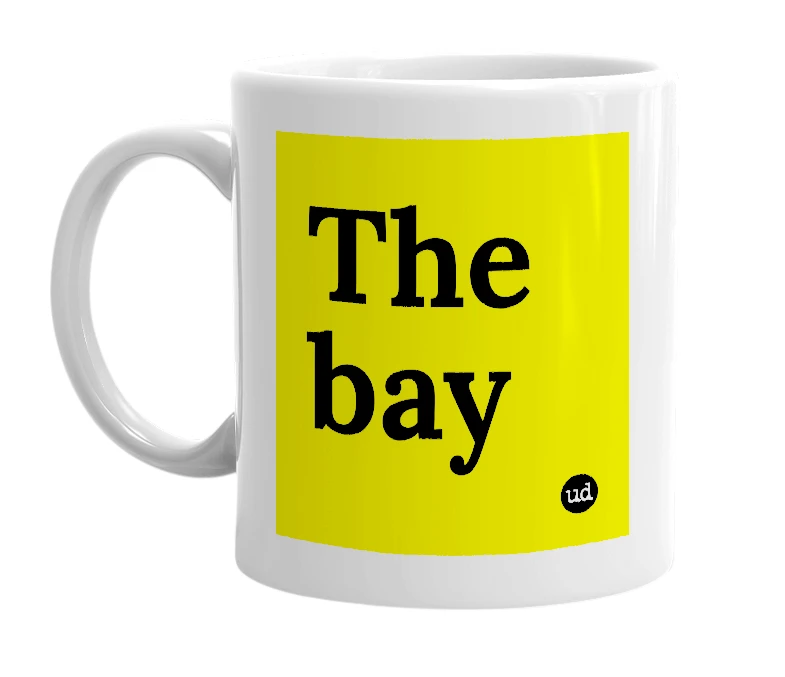 White mug with 'The bay' in bold black letters