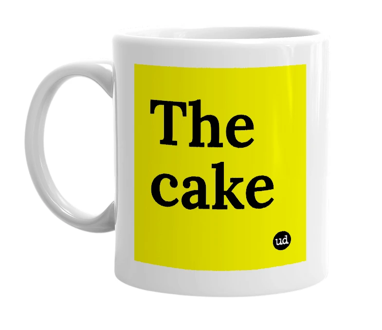 White mug with 'The cake' in bold black letters