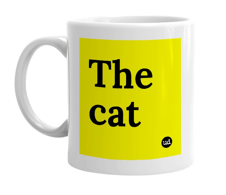 White mug with 'The cat' in bold black letters