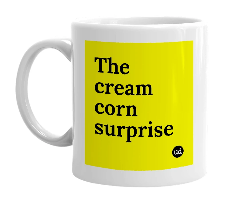 White mug with 'The cream corn surprise' in bold black letters