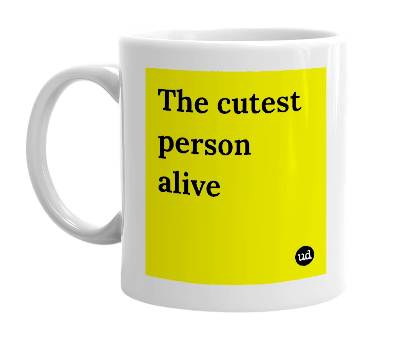 White mug with 'The cutest person alive' in bold black letters