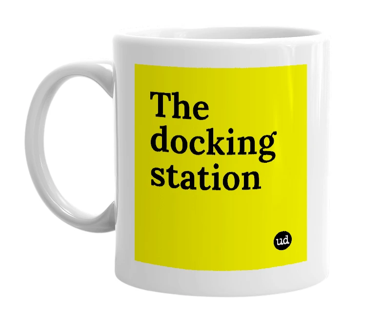 White mug with 'The docking station' in bold black letters