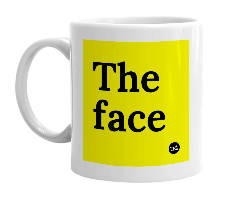 White mug with 'The face' in bold black letters