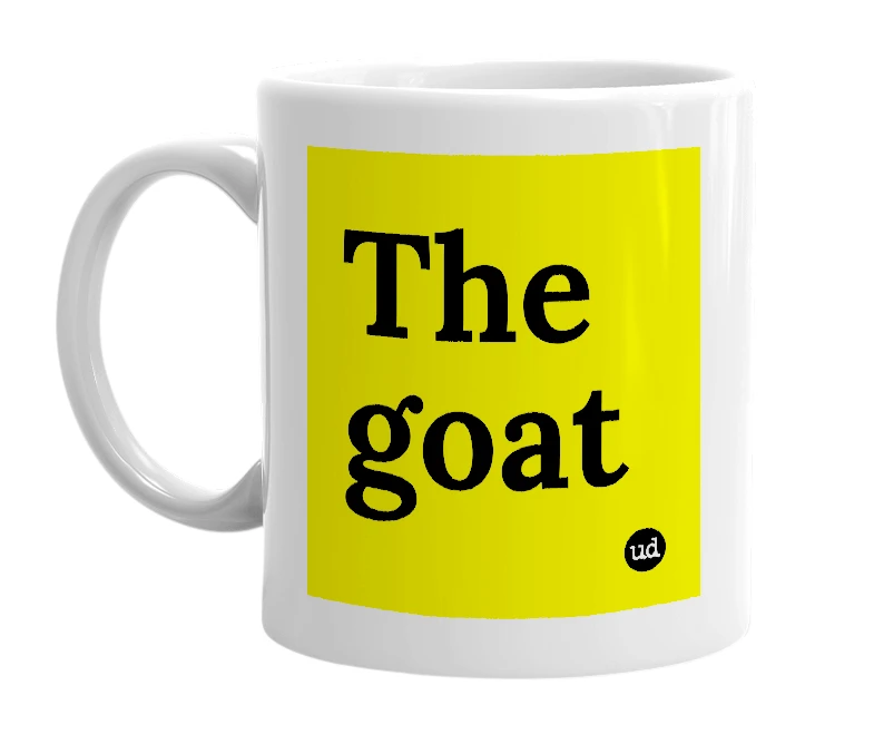 White mug with 'The goat' in bold black letters