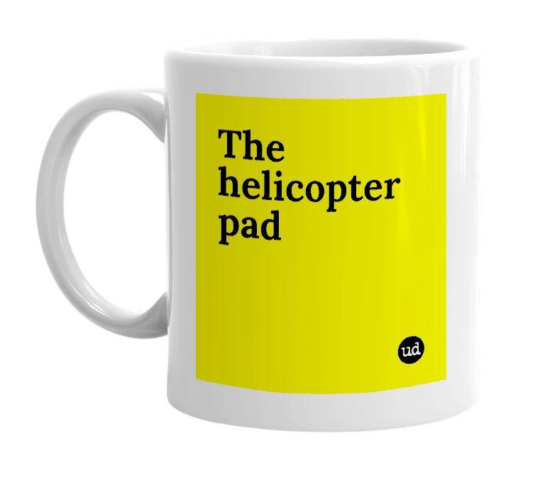 White mug with 'The helicopter pad' in bold black letters