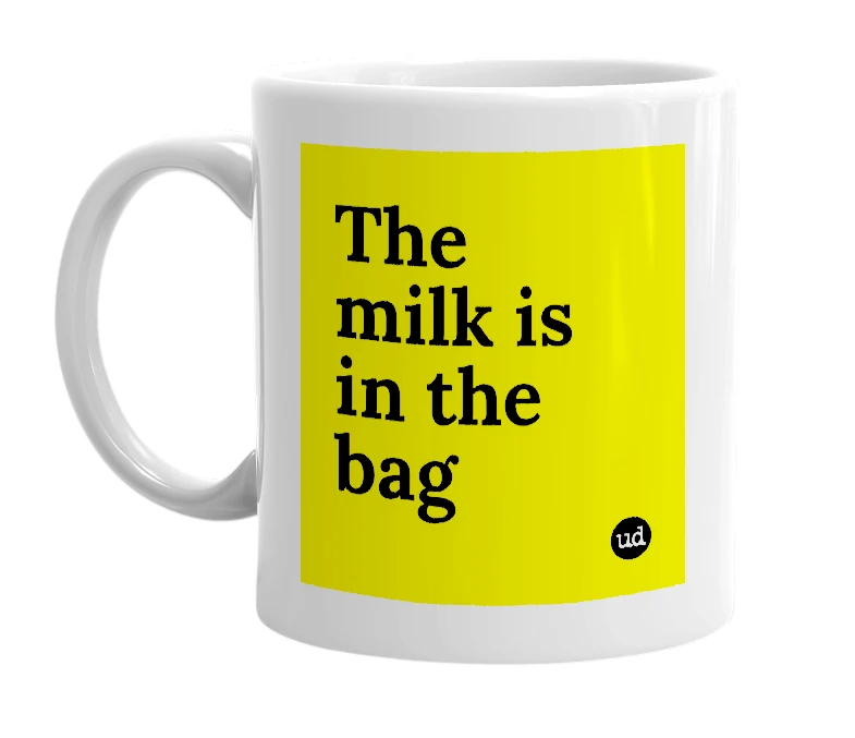 White mug with 'The milk is in the bag' in bold black letters