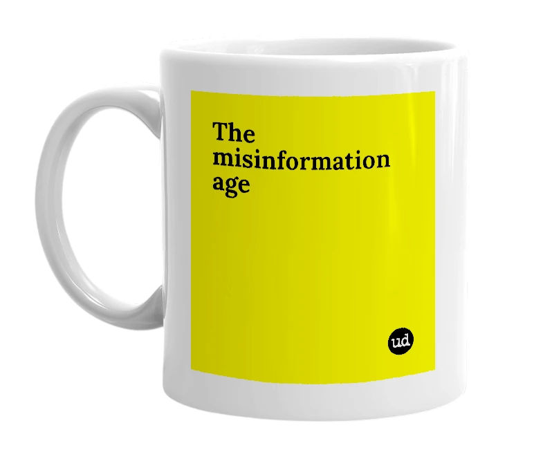 White mug with 'The misinformation age' in bold black letters