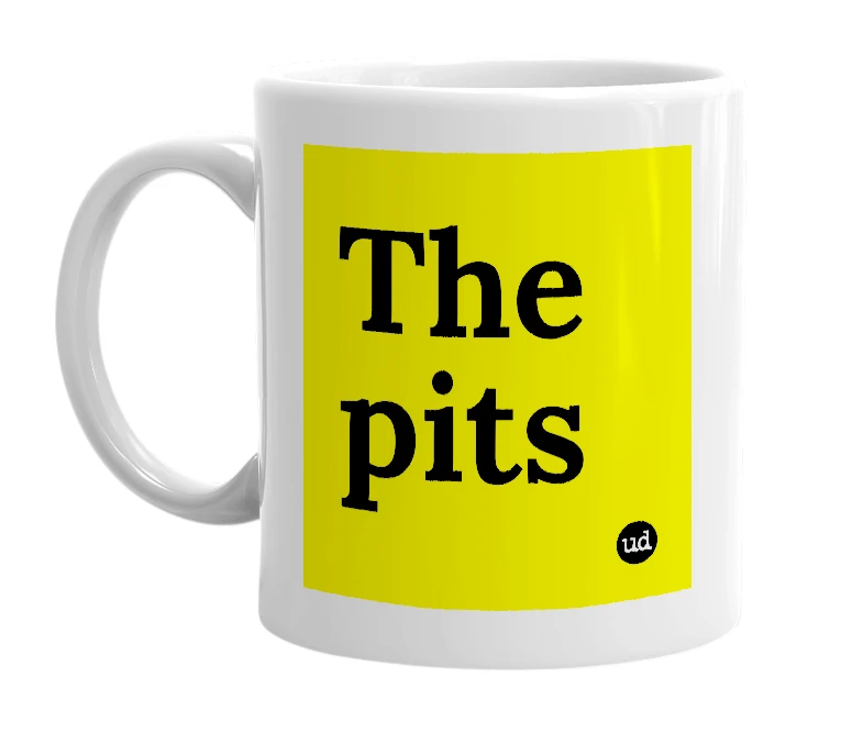White mug with 'The pits' in bold black letters