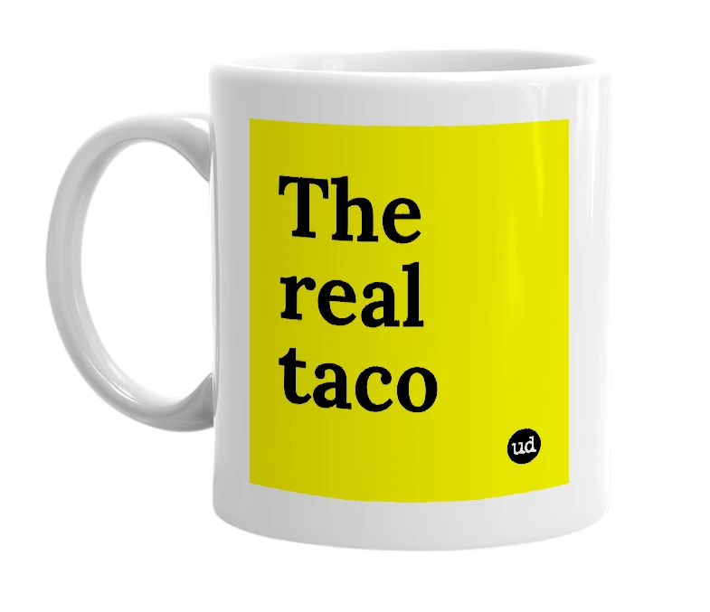 White mug with 'The real taco' in bold black letters