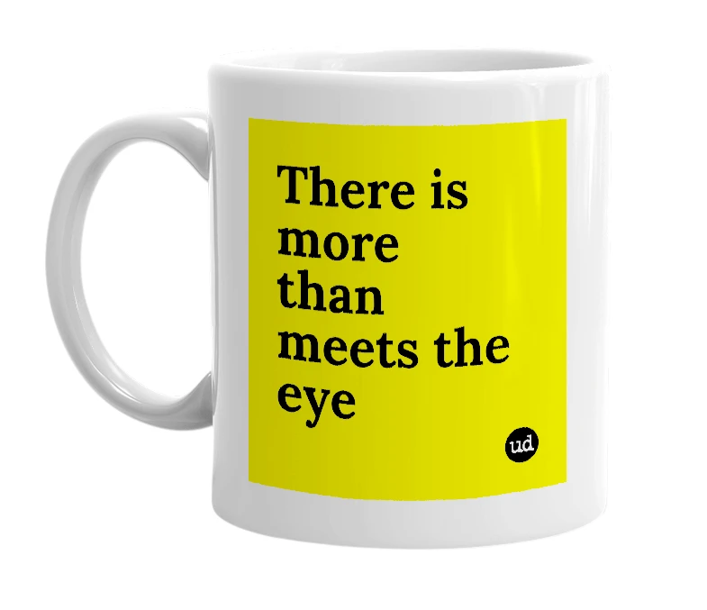 White mug with 'There is more than meets the eye' in bold black letters