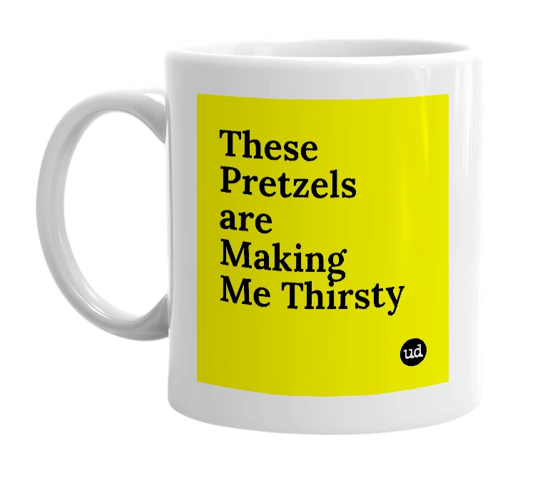 White mug with 'These Pretzels are Making Me Thirsty' in bold black letters