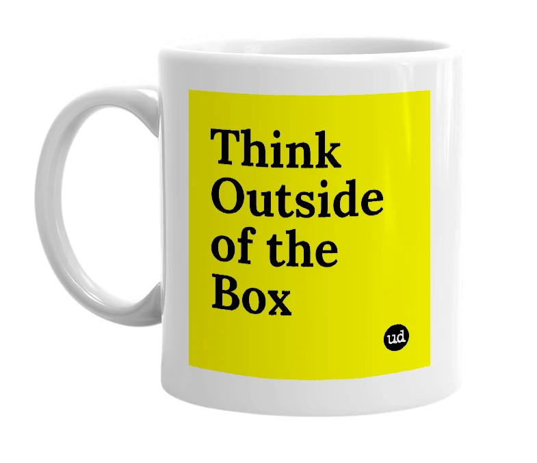 White mug with 'Think Outside of the Box' in bold black letters