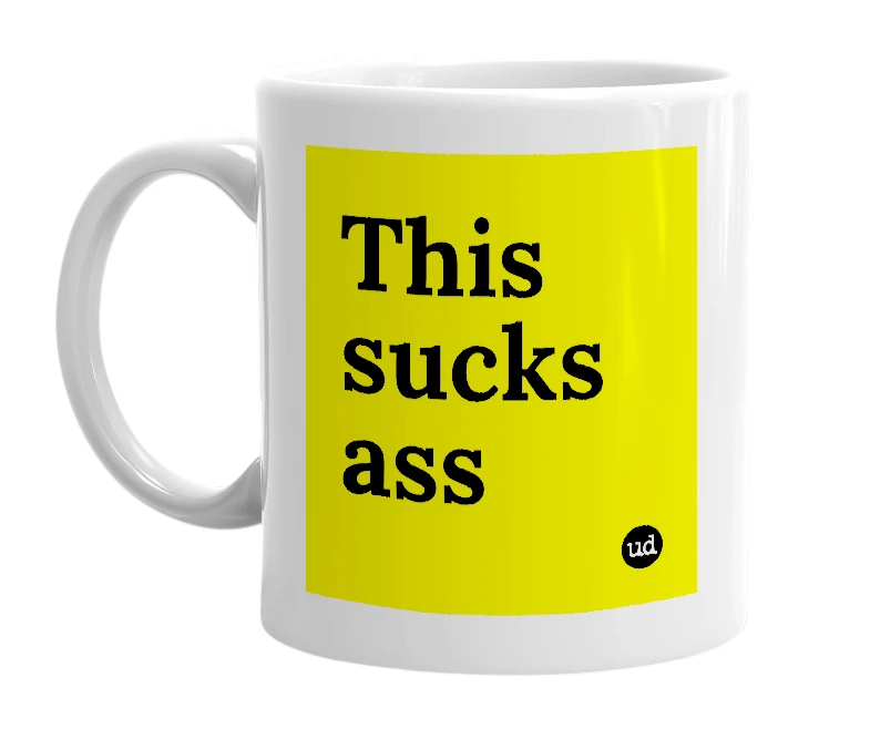 White mug with 'This sucks ass' in bold black letters