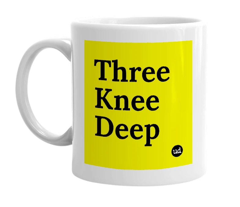 White mug with 'Three Knee Deep' in bold black letters