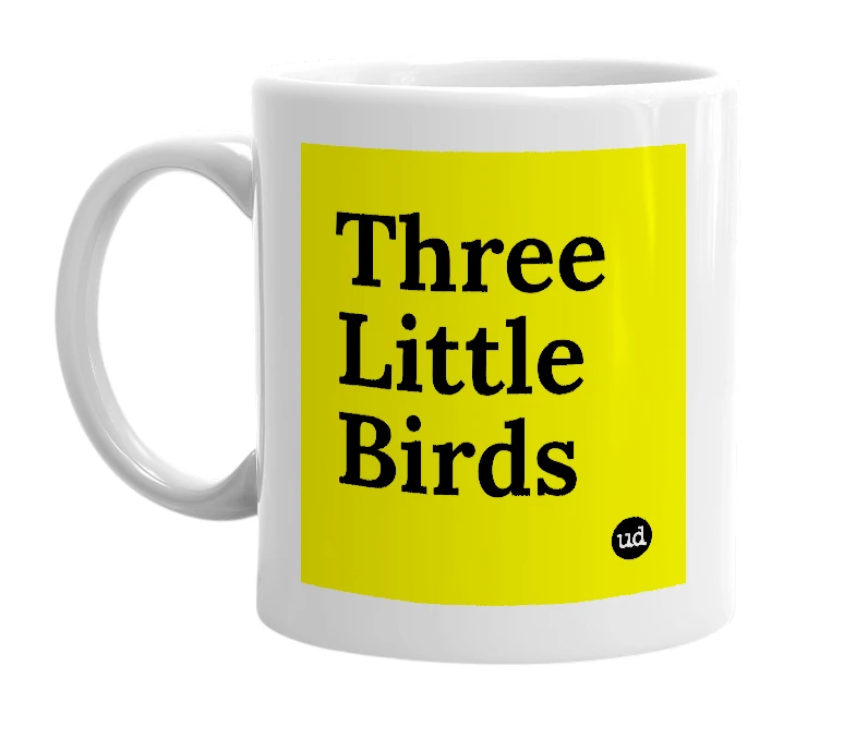 White mug with 'Three Little Birds' in bold black letters