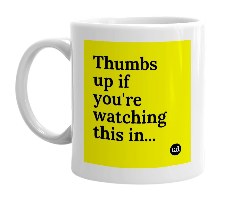 White mug with 'Thumbs up if you're watching this in...' in bold black letters