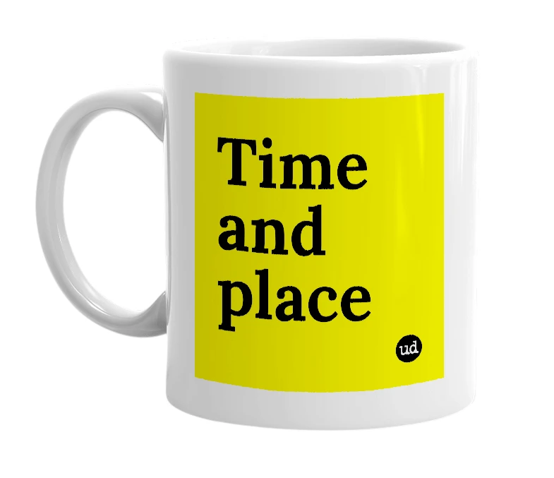 White mug with 'Time and place' in bold black letters