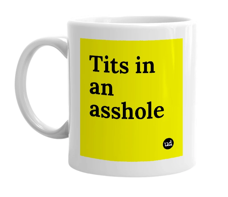 White mug with 'Tits in an asshole' in bold black letters