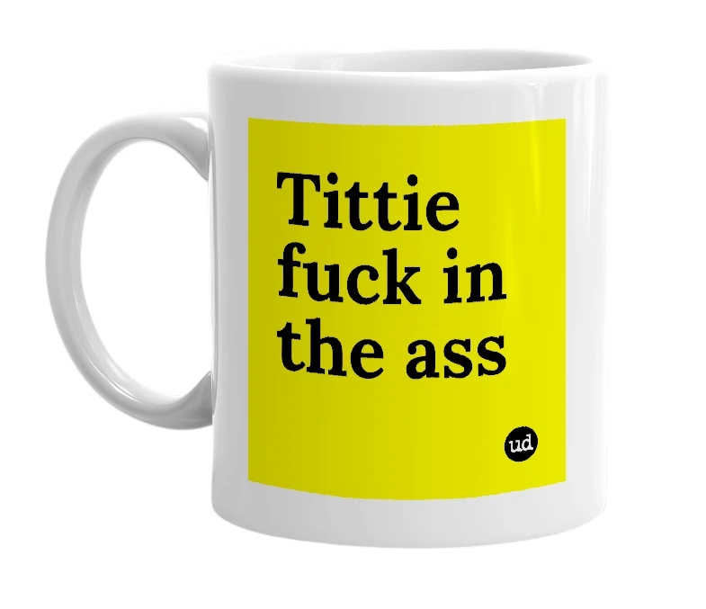 White mug with 'Tittie fuck in the ass' in bold black letters