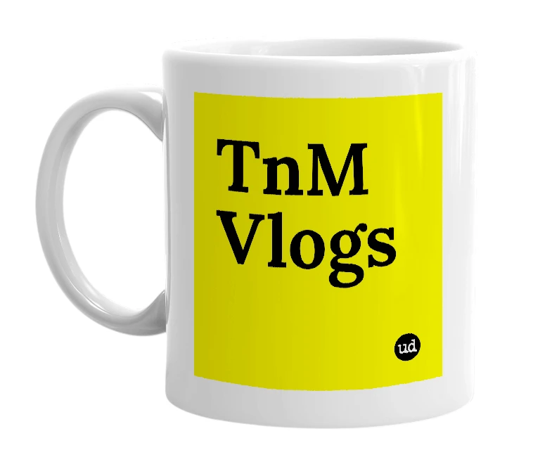 White mug with 'TnM Vlogs' in bold black letters