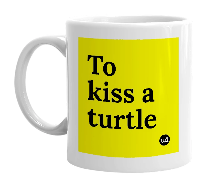White mug with 'To kiss a turtle' in bold black letters