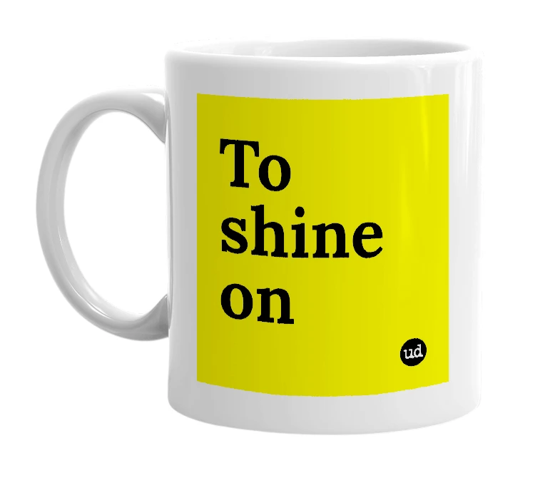 White mug with 'To shine on' in bold black letters